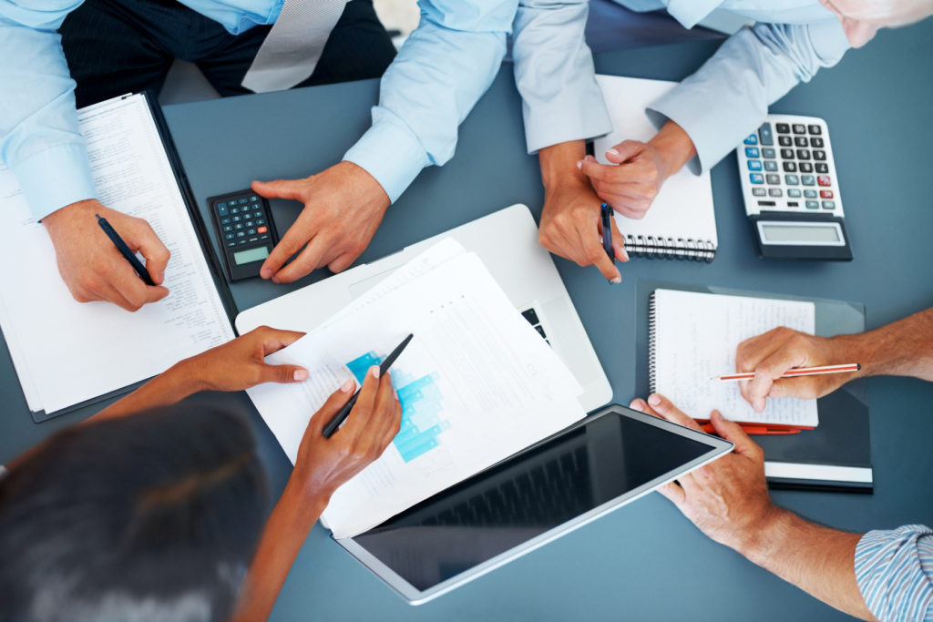 Cropped image of hands of businesspeople working together on business project at office - Consulting